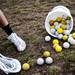 A Skyline lacrosse player scoops up a ball during practice on Monday, April 8. Daniel Brenner I AnnArbor.com